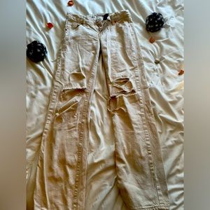 Tan ripped denim pants